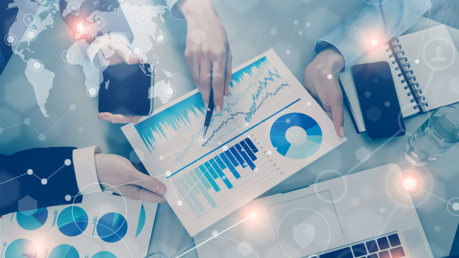 iStock-650191334 Business people meeting with technology in office, visual interfaces effects