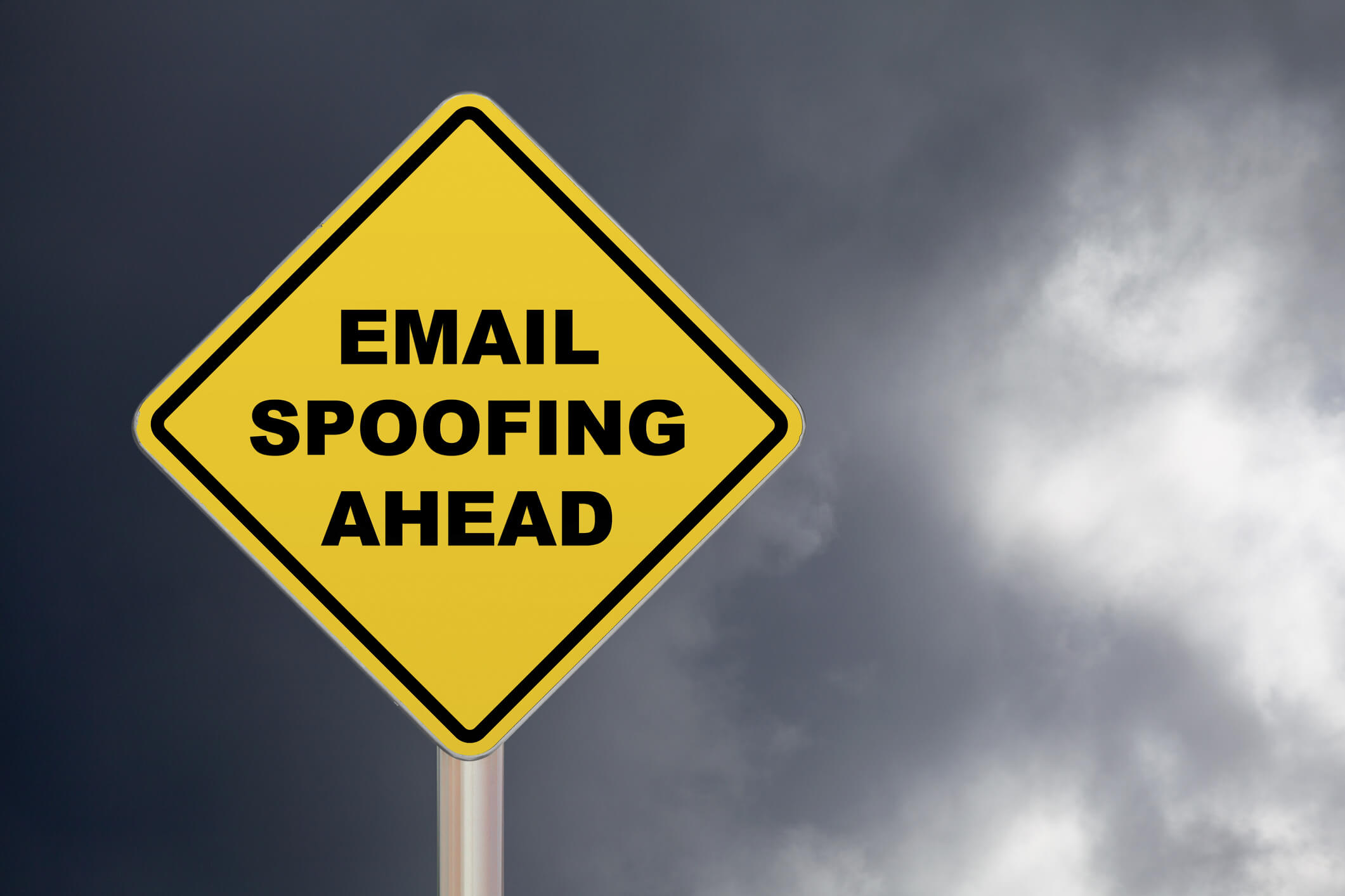 Crossing Sign – Email spoofing ahead yellow warning sign: how to stop enterprise domail email spoofing - valimail