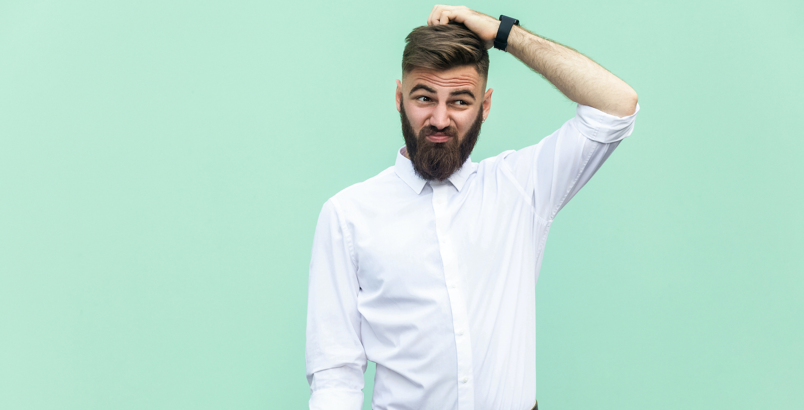 Not sure. Young adult businessman have a doubt. photo of young man looking doubtful