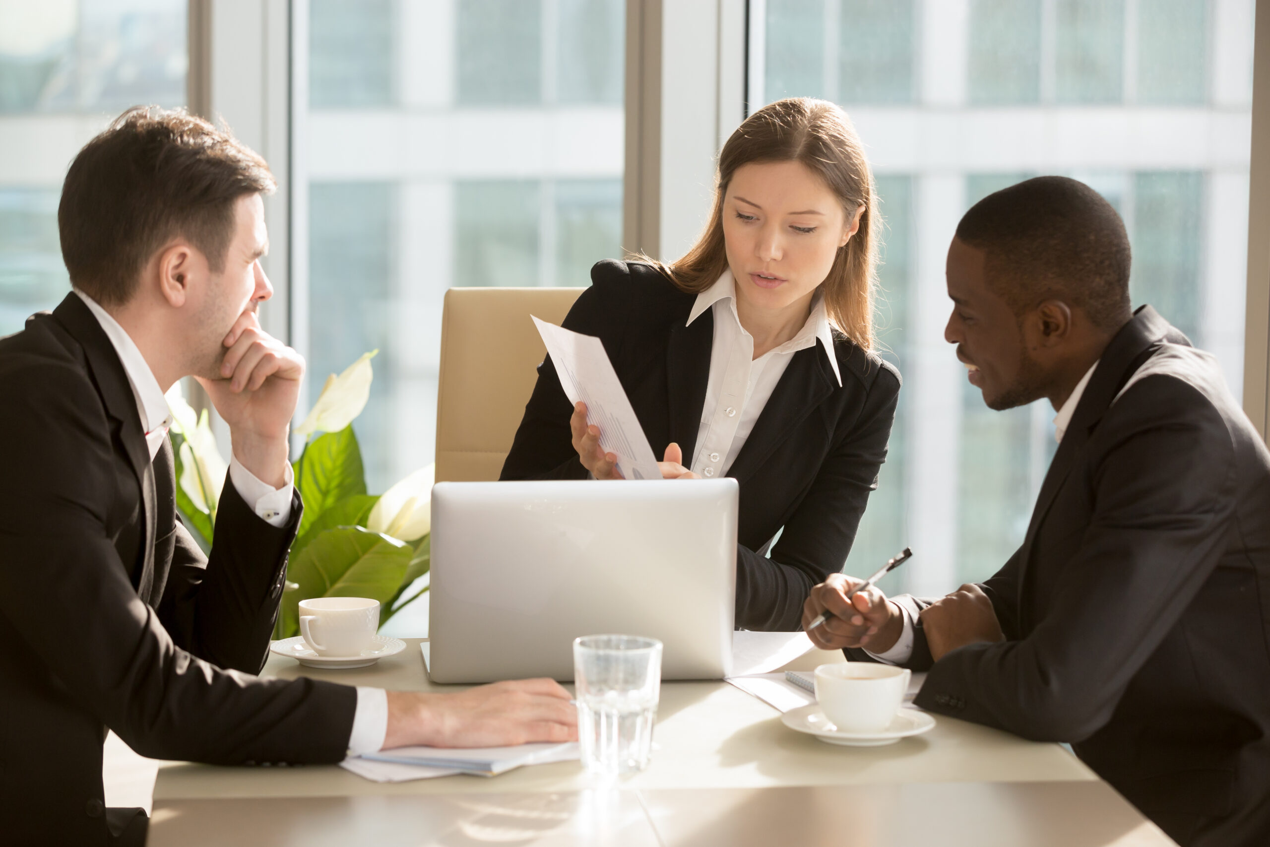 Female CEO explaining deal financial perspectives Female CEO explaining deal financial perspectives