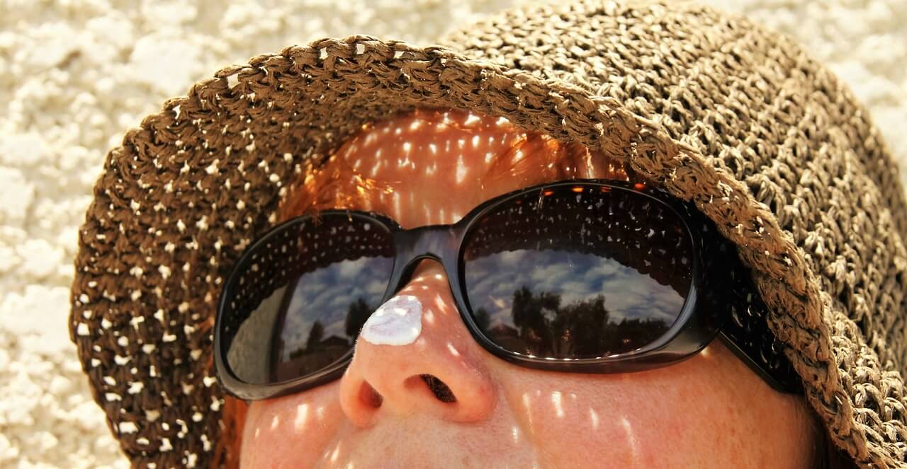 person with sunscreen on nose