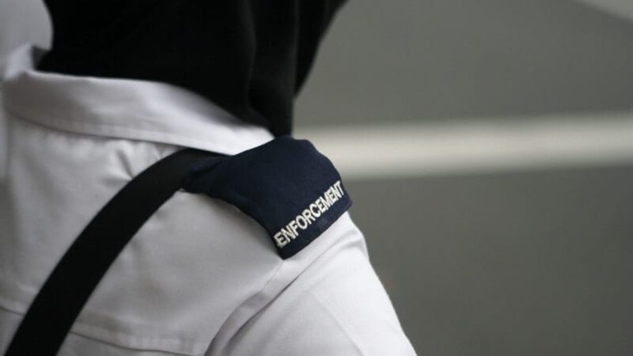 Close up image of "Enforcement" shoulder badge.