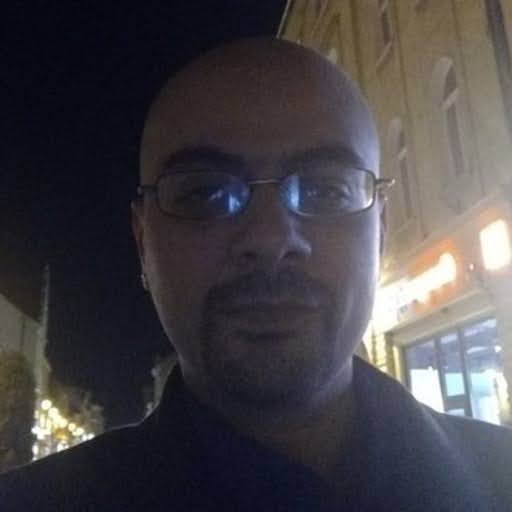 Iulian headshot valimail support team 